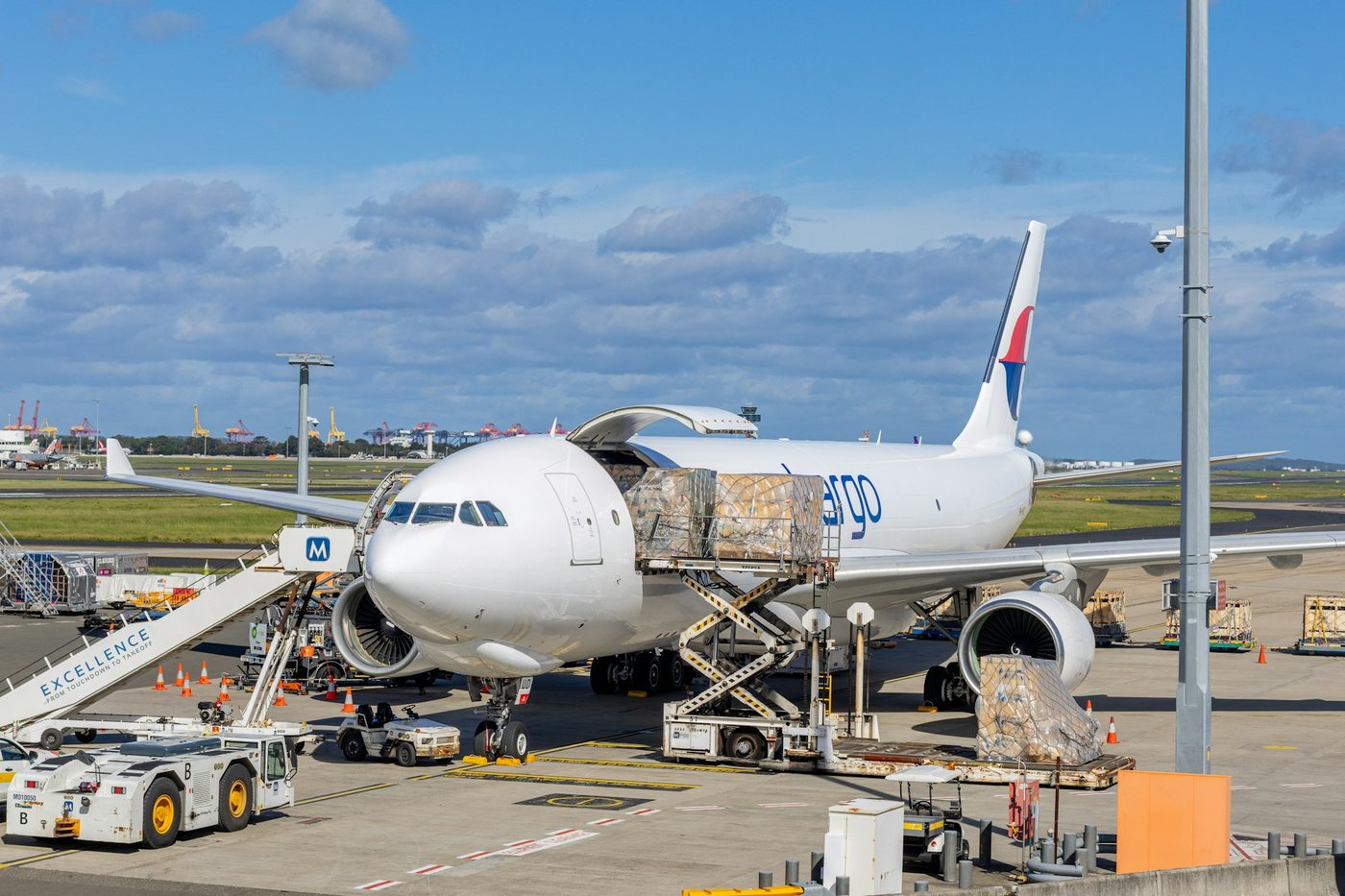 Cargo freighter aircraft being loaded with palletised freight