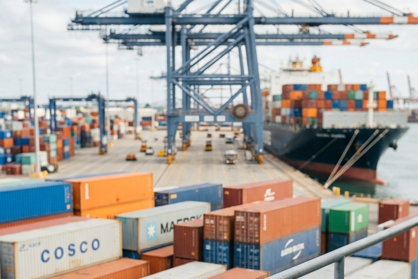 Container terminal with gantry cranes and stacked containers awaiting clearance